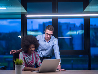 Image showing Multiethnic startup business team in night office