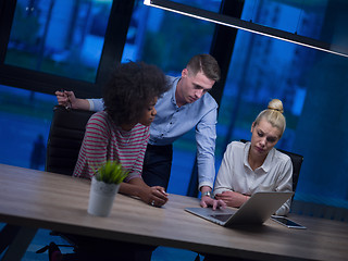 Image showing Multiethnic startup business team in night office