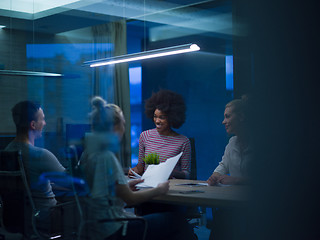 Image showing Multiethnic startup business team in night office