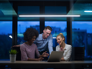 Image showing Multiethnic startup business team in night office