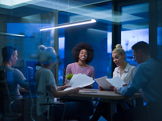 Image showing Multiethnic startup business team in night office