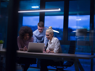 Image showing Multiethnic startup business team in night office