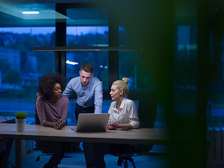 Image showing Multiethnic startup business team in night office