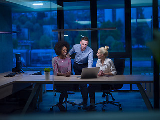 Image showing Multiethnic startup business team in night office