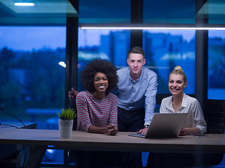 Image showing Multiethnic startup business team in night office