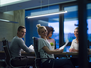 Image showing Multiethnic startup business team in night office