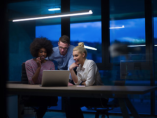 Image showing Multiethnic startup business team in night office