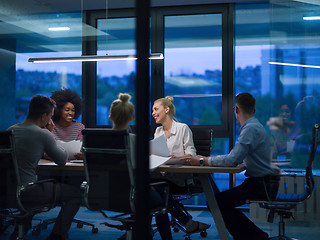 Image showing Multiethnic startup business team in night office