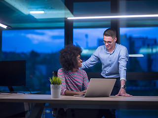 Image showing Multiethnic startup business team in night office