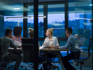 Image showing Multiethnic startup business team in night office