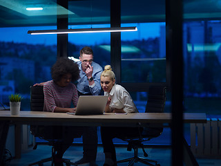 Image showing Multiethnic startup business team in night office