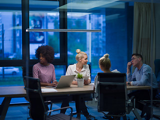 Image showing Multiethnic startup business team in night office