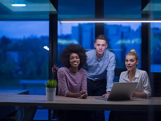 Image showing Multiethnic startup business team in night office