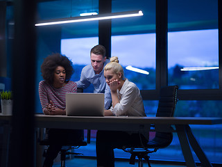 Image showing Multiethnic startup business team in night office