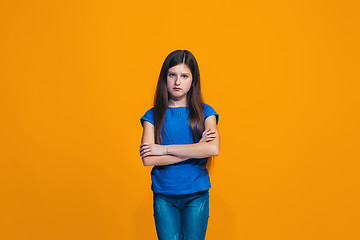 Image showing Young serious thoughtful teen girl. Doubt concept.