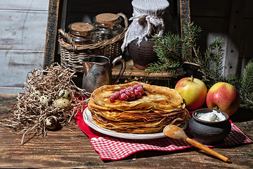 Image showing Pancakes On An Old Wooden desk