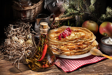 Image showing Pancakes On An Old Wooden desk