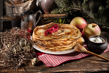 Image showing Pancakes On An Old Wooden desk
