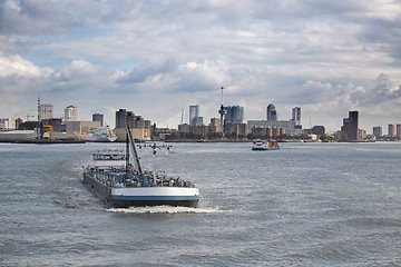 Image showing Ship carrying containers through rotterdam