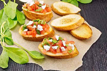 Image showing Bruschetta with tomato and cheese on board