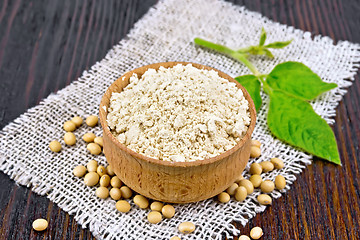 Image showing Flour soy in bowl with leaf on board