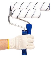 Image showing Hand with glove and paint roller