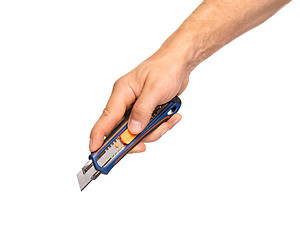 Image showing Hand holding stationery knife