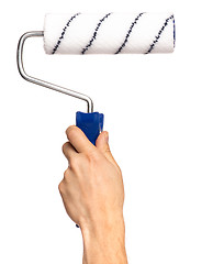 Image showing Hand with paint roller