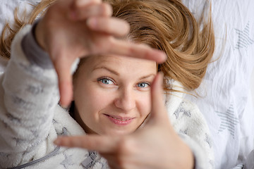 Image showing Woman lying in bed