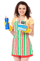 Image showing Young housewife on white