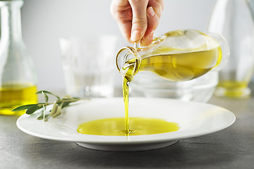 Image showing Olive oil pouring