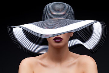 Image showing Beautiful girl in large hat