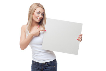 Image showing Beautiful blond girl holding blank poster
