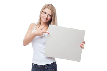 Image showing Beautiful blond girl holding blank poster