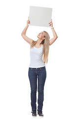 Image showing Beautiful blond girl holding blank poster