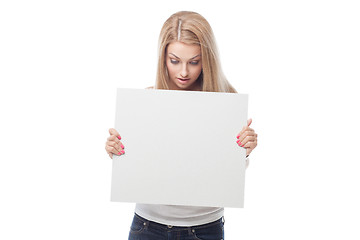 Image showing Beautiful blond girl holding blank poster