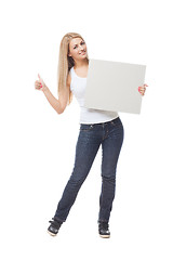 Image showing Beautiful blond girl holding blank poster