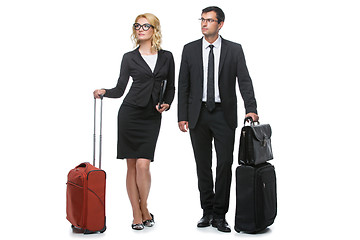 Image showing Businessman and business woman with travel cases