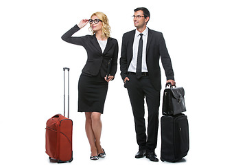 Image showing Businessman and business woman with travel cases