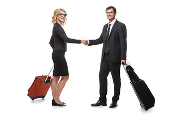 Image showing Businessman and business woman with travel cases