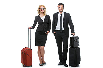 Image showing Businessman and business woman with travel cases