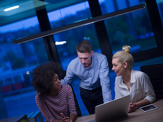 Image showing Multiethnic startup business team in night office