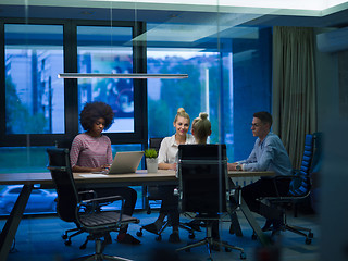 Image showing Multiethnic startup business team in night office