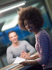 Image showing Multiethnic startup business team in night office