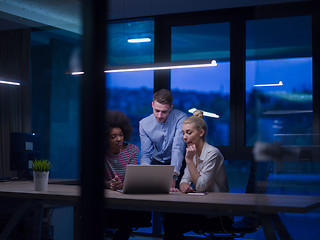 Image showing Multiethnic startup business team in night office