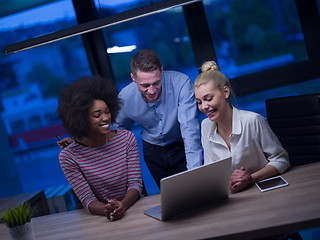 Image showing Multiethnic startup business team in night office