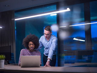 Image showing Multiethnic startup business team in night office