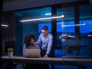 Image showing Multiethnic startup business team in night office