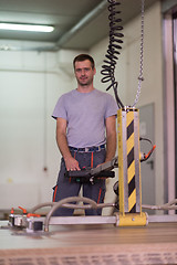 Image showing worker in a factory of wooden furniture