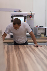 Image showing worker in a factory of wooden furniture